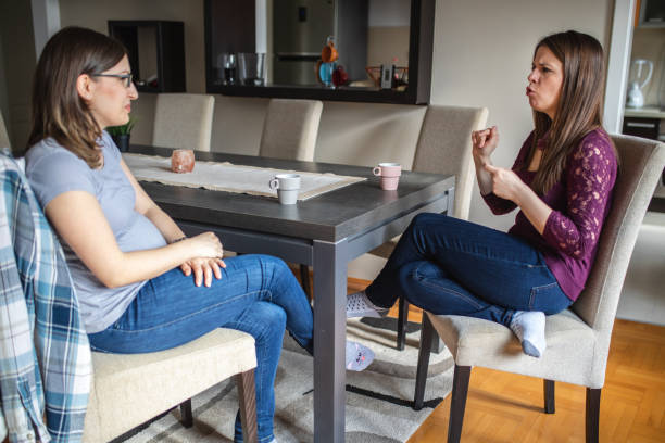 istock Deaf women enjoying their coffee break at an apartment 1142366452