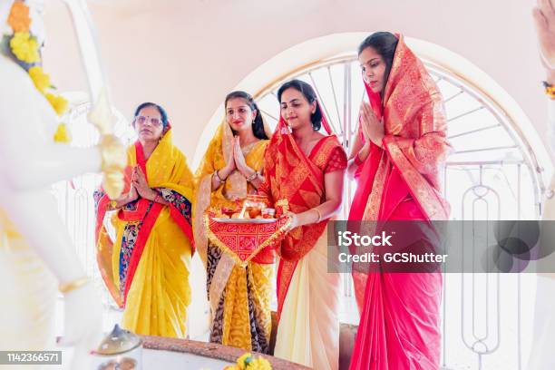 Group Of Indian Women Praying At The Temple Stock Photo - Download Image Now - Navratri, Happiness, Celebration