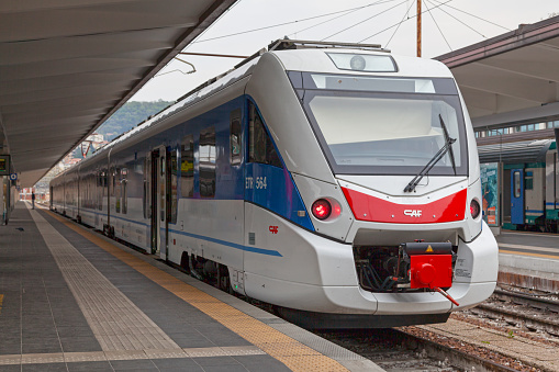 Trieste, Italy - April 09 2019: ETR 564 manufactured by the  Spanish company CAF and operated by the Italian company Ferrovie dello Stato.
