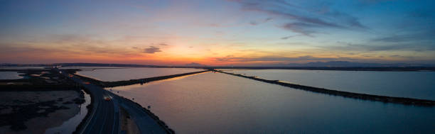 istock Salt dams in sunset, Spain, and road 1142370132