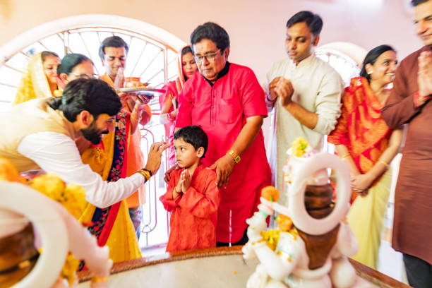 istock Multi Generation Family Attending a Hindu Traditional Prayers at a temple 1142376861