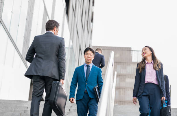 istock Business People Walking On Stairs 1142378522
