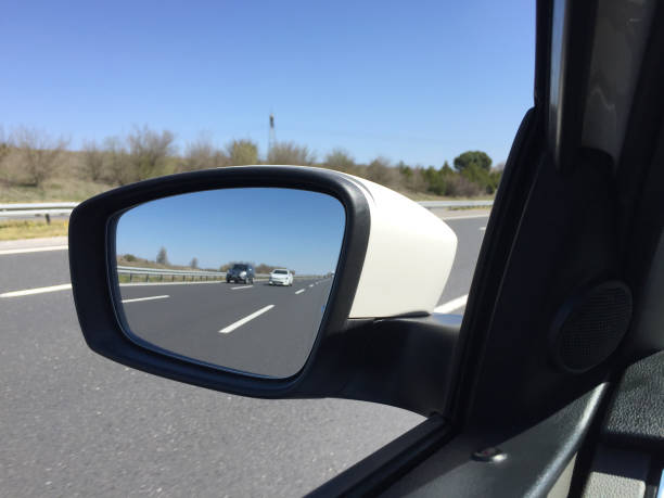 istock Car mirror, rear view mirror with highway 1142379338
