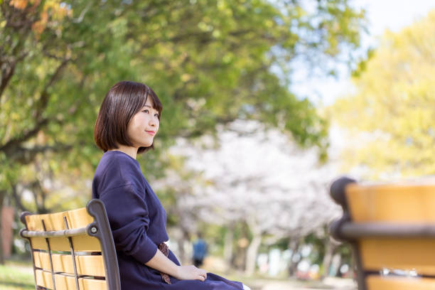 istock Woman relaxing on the bench 1142381419