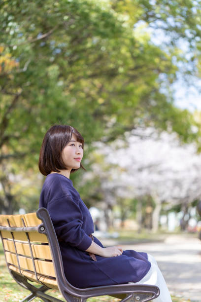 istock Woman relaxing on the bench 1142381453