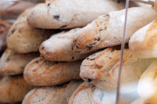 baguette , white bread closeup in behind glass at bakery