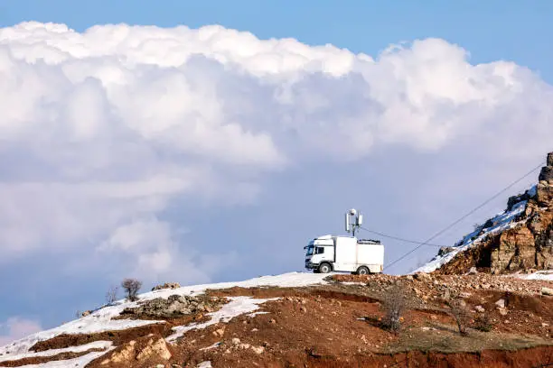 Photo of Mobile internet, phone, GPS navigation device and satellite receiver on the hill.