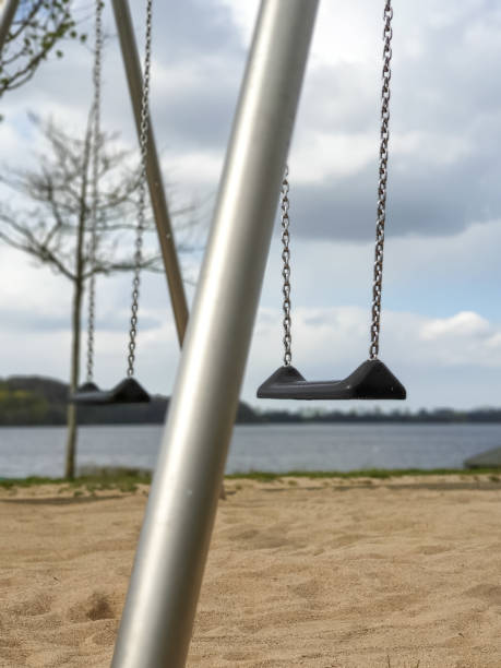 istock swing on the playground 1142386288