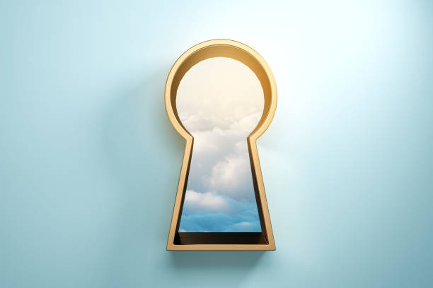 Blue wall with golden keyhole stock photo