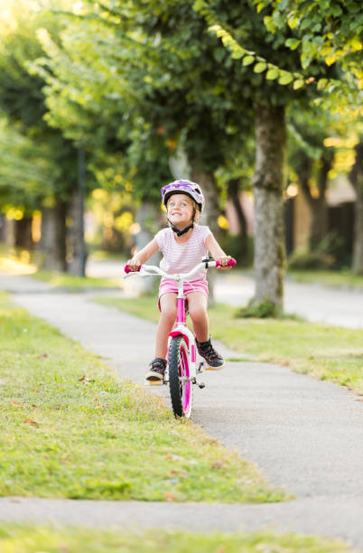 istock Girl Riding Bicycle 1142389519