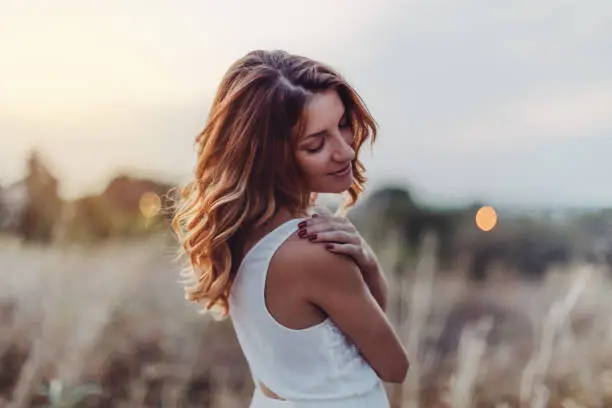 Dreamy beautiful woman outdoors