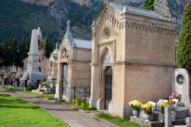 Graves and footpath on old cemetery in eastern outskirts of Palermo, cemetery from 19th century.
