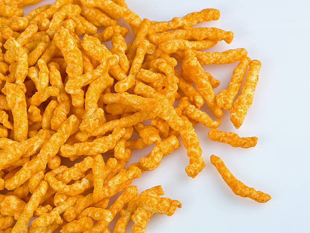 istock Orange crunchy cheese puff crisps. 114239561