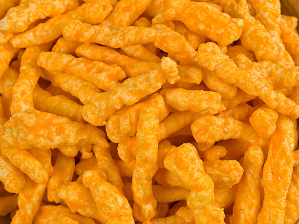 istock Crunchy Cheese Puffs Background 114239564