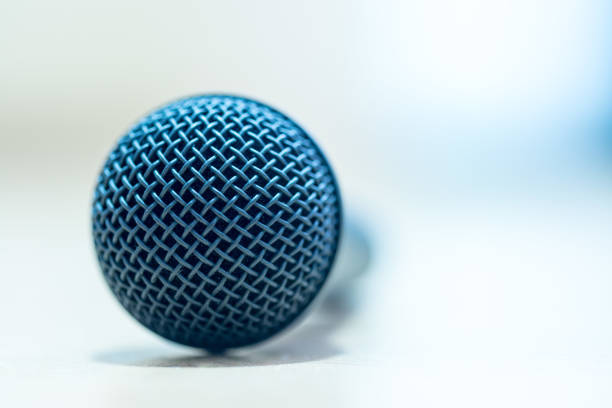 istock Interview: Black microphone is standing on the desk, copy space. 1142395828