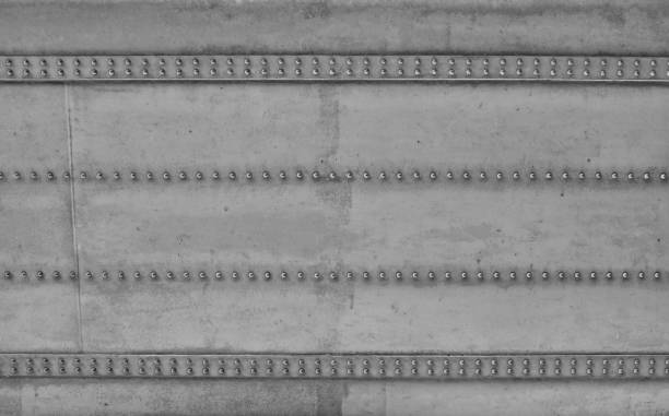 Steel and Rivets Construction Of a Bridge-Industrial Design Close-up of a massive construction of a bridge. which gets its stability with steel rivets. Industrial style as design elements such as backgrounds. girder photos stock pictures, royalty-free photos & images