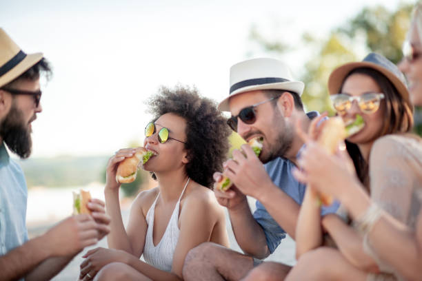 istock Friends having fun at beach party 1142396802