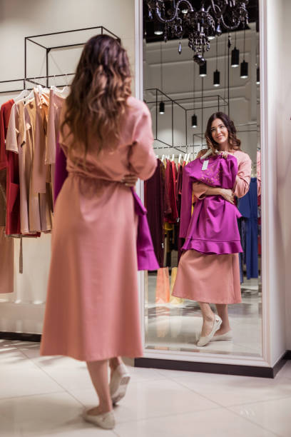 istock Young woman at the mirror 1142398528
