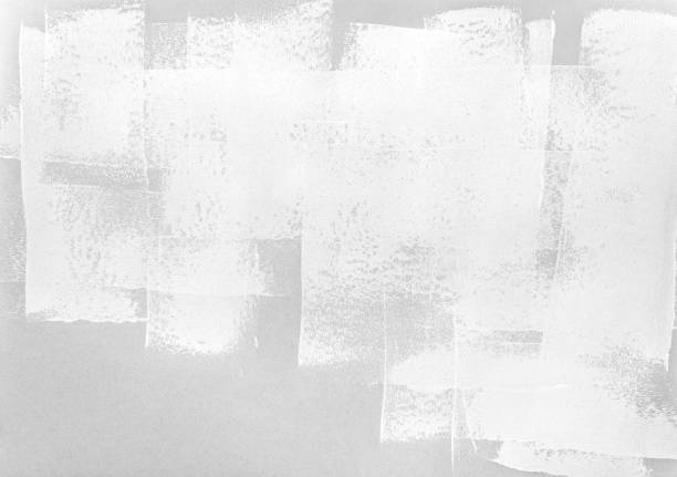 istock paint roller strokes on grey paper background. monochrome texture. 1142401617