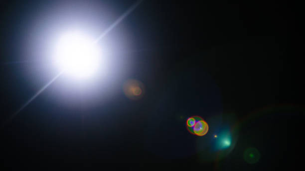 istock Abstract Natural Sun flare or Far star on the black background 1142401858