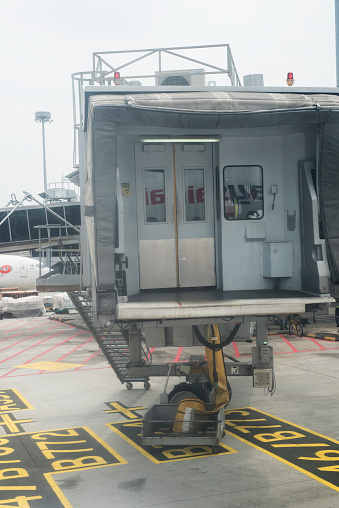 Boarding tunnel is pulled away from the plane before take off at Kuala Lumpur International Airport in Malaysia.