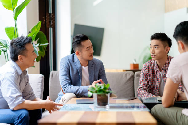 istock Busy design office workers having an informal meeting 1142402755