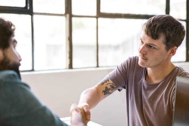 istock Close up of handshake in the office. 1142403681