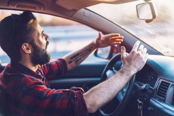 istock Angry young man driving on the highway 1142403851