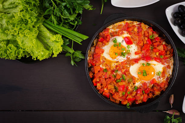 istock Turkish Breakfast -  shakshuka, olives, cheese and fruit. Rich brunch. Top view 1142403894