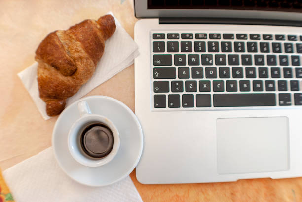 istock Freshly baked croissants and coffee 1142403930