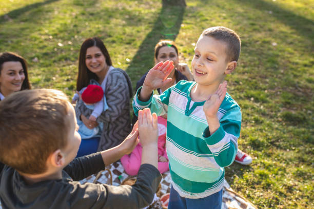 istock Kids playing in park on a lovely spring day 1142404714