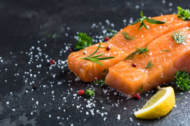 istock Salmon fish fillets on dark marble table 1142406052