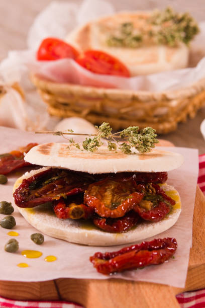 istock Tigella bread with sun-dried tomatoes. 1142406145