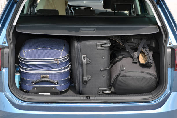 istock Suitcases and backpack in the car trunk 1142409498
