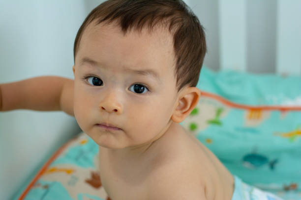istock Baby boy in the crib 1142410881