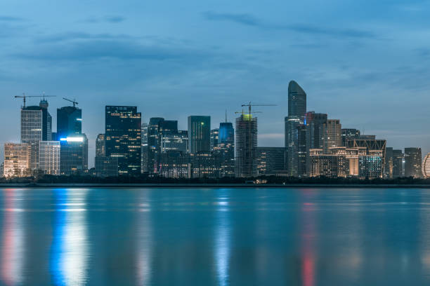 istock night view of modern city waterfront downtown skyline,China. 1142411221