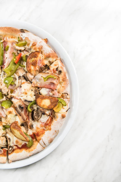 istock Bacon and green pepper traditional pizza 1142411762