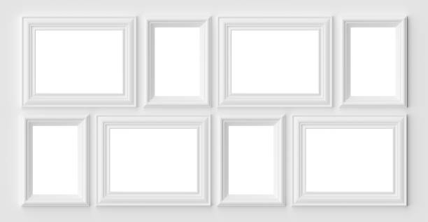 istock White photo or picture frames on the white wall with shadows 1142413932