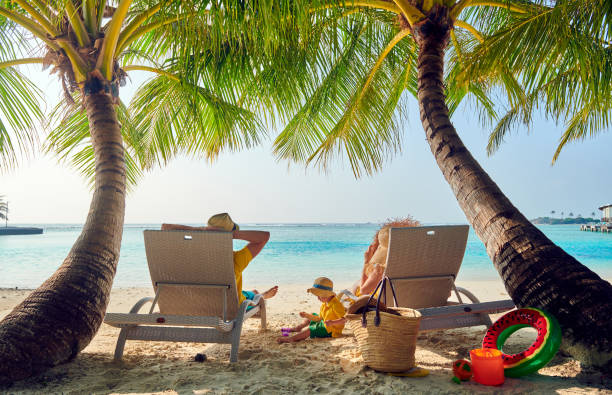 istock Family with three year old boy on beach 1142417166