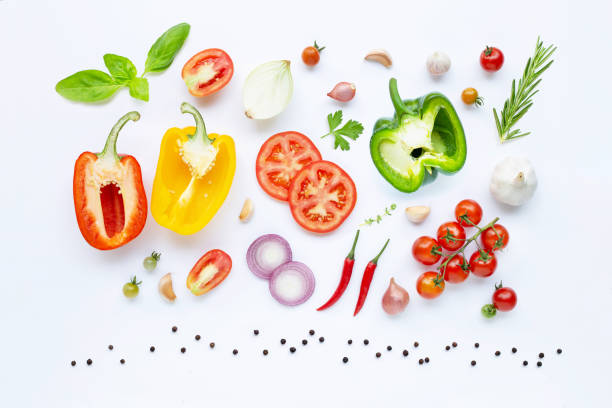istock Various fresh vegetables and herbs on white background. Healthy eating concept 1142418680