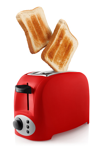 Roasted toasts popping out of a red toaster, isolated on white background
