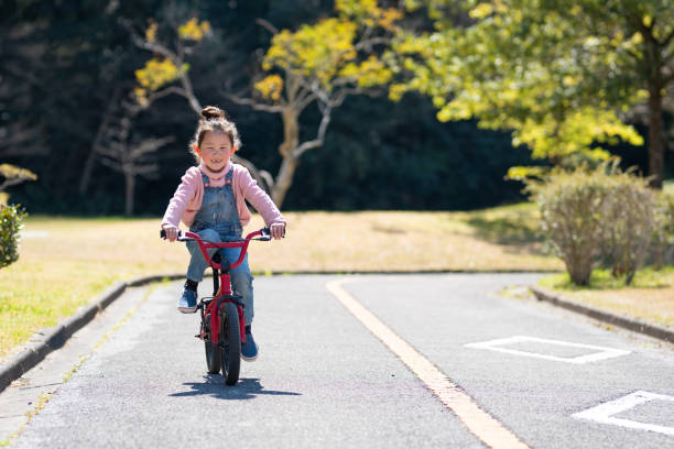 istock Girl riding a bicycle 1142419545