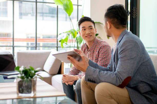 istock Coworkers having an informal meeting in a modern office 1142420290