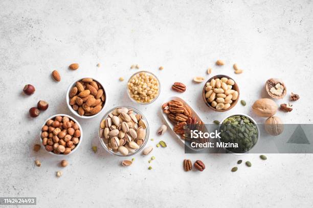 Various Nuts In Bowls Stock Photo - Download Image Now - Nut - Food, Seed, Snack