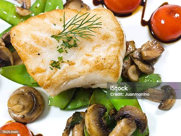 Saute Fillet Of Seabass Stock Photo - Download Image Now - Bean, Cherry Tomato, Close-up