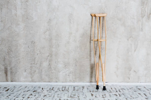 wooden crutches on the white wal.