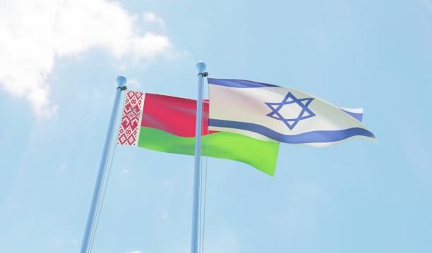 istock Belarus and Israel, two flags waving against blue sky 1142425806