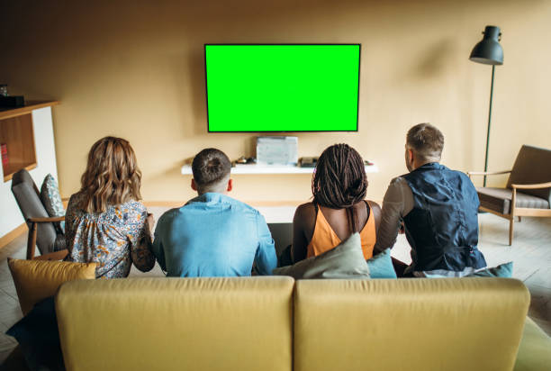 istock Carefree freelancers having fun playing video games and watching tv 1142425953
