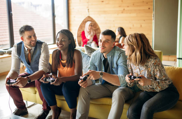 istock Carefree freelancers having fun playing video games 1142426957