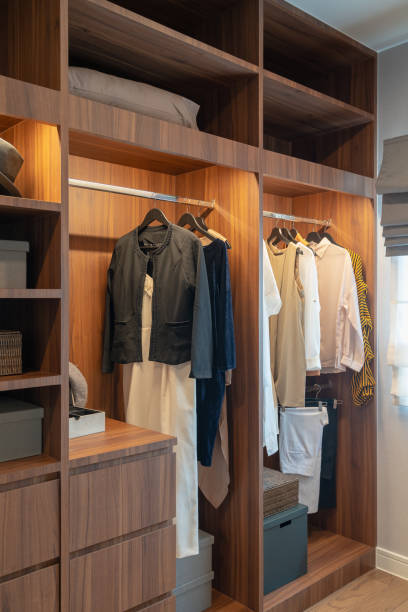 istock modern closet with clothes hanging 1142427148